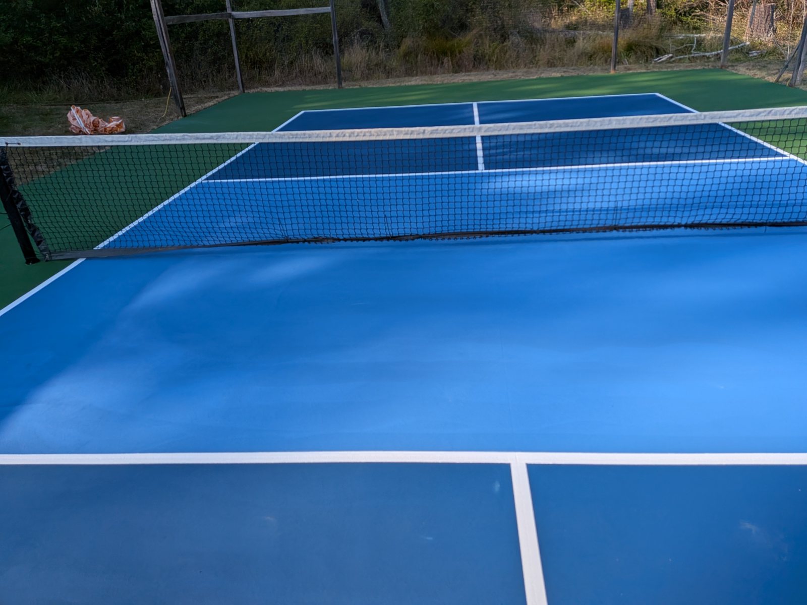 Completed court surface with new net and crisp lines