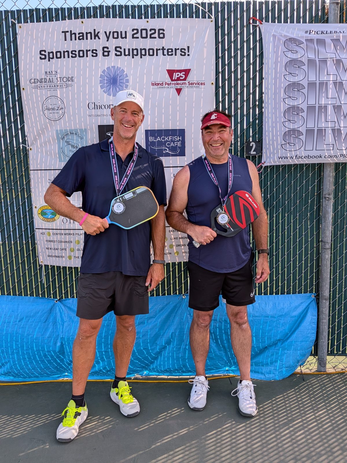 David Kane and doubles partner Adam with medals at the Orcas Island tournament